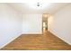 Bright living room featuring modern lighting, neutral walls, and stylish wood-look flooring throughout the space at 6 Dawson Ct Ct, Durham, NC 27703