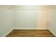 Walk-in closet with shelving and wood-look floors at 6 Dawson Ct Ct, Durham, NC 27703
