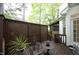 Cozy back patio features charming lattice privacy screen at 6022 Four Townes Lane Ln, Raleigh, NC 27616