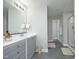 Bathroom with large vanity, tile floor, and glass enclosed shower at 6022 Four Townes Lane Ln, Raleigh, NC 27616