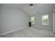 Bright bedroom with vaulted ceilings, plush carpet, and plenty of natural light at 6022 Four Townes Lane Ln, Raleigh, NC 27616
