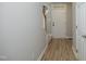 Clean, bright foyer with wood-look flooring, neutral walls, and a view of the staircase at 6022 Four Townes Lane Ln, Raleigh, NC 27616