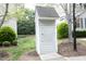 Mailbox kiosk featuring individual mailboxes set amongst lush greenery and landscaping at 6022 Four Townes Lane Ln, Raleigh, NC 27616