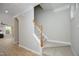 Carpeted staircase with white banisters and wood handrail, leading to the upper level of the home at 6022 Four Townes Lane Ln, Raleigh, NC 27616
