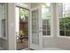 Light-filled sunroom with large windows and access to the outdoor patio at 6022 Four Townes Lane Ln, Raleigh, NC 27616