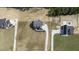 Aerial view of the two-story home on a large lot with a long driveway at 67 Farmstead Ct, Wendell, NC 27591