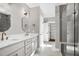 Bathroom showing a shower, double vanity sink, and closet at 67 Farmstead Ct, Wendell, NC 27591