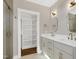 Bathroom featuring double sinks, a closet and granite countertops at 67 Farmstead Ct, Wendell, NC 27591