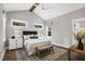 Bright bedroom featuring a vaulted ceiling, hardwood floors, and large windows at 67 Farmstead Ct, Wendell, NC 27591