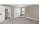 A bedroom featuring carpet, a closet, and a window at 67 Farmstead Ct, Wendell, NC 27591