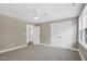 This bedroom features neutral walls, carpet, closet doors, and windows letting in light at 67 Farmstead Ct, Wendell, NC 27591