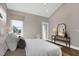 Bright, cozy bedroom featuring hardwood floors, neutral colors, and ample natural light at 67 Farmstead Ct, Wendell, NC 27591