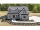 Two-story home featuring a gray exterior, black roof, and landscaped front yard at 67 Farmstead Ct, Wendell, NC 27591