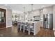 Spacious kitchen with center island, stainless steel appliances, and adjacent dining area at 67 Farmstead Ct, Wendell, NC 27591
