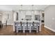 Open kitchen with a large island, pendant lighting, and seating for four at 67 Farmstead Ct, Wendell, NC 27591