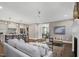 Spacious living room with kitchen views, neutral colors, and comfortable seating at 67 Farmstead Ct, Wendell, NC 27591