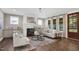 Relaxing living room with fireplace, stylish decor, and ample natural light at 67 Farmstead Ct, Wendell, NC 27591