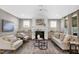 Comfortable living room featuring a fireplace, neutral paint, and plush seating at 67 Farmstead Ct, Wendell, NC 27591