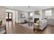 Inviting living room with fireplace, neutral decor, and hardwood floors at 67 Farmstead Ct, Wendell, NC 27591