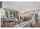 Open-concept living room flowing to the kitchen, featuring hardwood floors and neutral tones at 67 Farmstead Ct, Wendell, NC 27591
