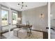 Bright office space featuring a decorative wall, a large window, and neutral decor at 67 Farmstead Ct, Wendell, NC 27591