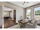 Cozy office with modern desk and chair, flowing into dining room with an open door frame at 67 Farmstead Ct, Wendell, NC 27591