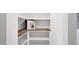 Organized pantry with white shelves and a butcher block countertop at 67 Farmstead Ct, Wendell, NC 27591