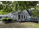 Spacious home exterior showcasing the expansive deck and backyard, perfect for outdoor entertaining and relaxation at 6765 Rock Service Station Rd Rd, Raleigh, NC 27603