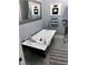 Luxurious bathroom featuring a modern soaking tub, elegant fixtures, and stylish decor at 6765 Rock Service Station Rd Rd, Raleigh, NC 27603