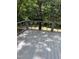 Outdoor deck area with wooded views, offering a serene space for relaxation and enjoying nature at 6765 Rock Service Station Rd Rd, Raleigh, NC 27603