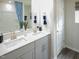 Modern bathroom featuring double sinks, white countertops, and stylish fixtures at 708 Deschutes Dr, Garner, NC 27529