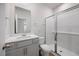 Modern bathroom with a glass shower, vanity, and mirror at 708 Deschutes Dr, Garner, NC 27529