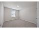 Bright bedroom with neutral carpet, a window, and modern paint at 708 Deschutes Dr, Garner, NC 27529