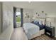 Serene bedroom with a queen-size bed, a view of the outdoors, hardwood floors, and tasteful decor at 708 Deschutes Dr, Garner, NC 27529