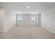 Spacious bonus room with plush carpet, recessed lighting, and two windows offering ample natural light at 708 Deschutes Dr, Garner, NC 27529