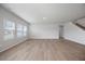 Open-concept living room with hardwood floors and staircase at 708 Deschutes Dr, Garner, NC 27529