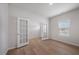 Bright office featuring hardwood floors, fresh paint, natural light from the window, and glass French doors at 708 Deschutes Dr, Garner, NC 27529