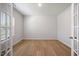 Bright office featuring hardwood floors, fresh paint, natural light from the window, and glass French doors at 708 Deschutes Dr, Garner, NC 27529