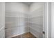 Walk-in pantry featuring multiple shelves and ample storage space perfect for organizing food and household supplies at 708 Deschutes Dr, Garner, NC 27529