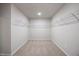 Spacious walk-in closet featuring carpeted flooring and wire shelving for optimal storage and organization at 708 Deschutes Dr, Garner, NC 27529