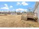 Expansive backyard featuring a wooden deck, perfect for outdoor relaxation and entertainment at 7289 Nc 561, Louisburg, NC 27549