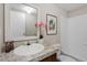 Clean bathroom with a vanity, bathtub, and decorative mirror at 7289 Nc 561, Louisburg, NC 27549