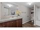 Bathroom featuring a vanity with a marble top, a mirror, and a shower/tub combo at 7289 Nc 561, Louisburg, NC 27549