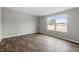 Bright bedroom with wood-look floors and natural light from the double windows at 7289 Nc 561, Louisburg, NC 27549