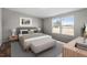 Serene bedroom boasts plenty of natural light, a comfortable bed, and neutral décor at 7289 Nc 561, Louisburg, NC 27549
