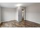 Simple bedroom with hardwood floors and white door at 7289 Nc 561, Louisburg, NC 27549