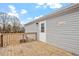 Wooden deck with a door to enter the house, offering a great outdoor space for relaxing and entertaining at 7289 Nc 561, Louisburg, NC 27549