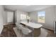 Contemporary dining room features a stylish table and a bright window view at 7289 Nc 561, Louisburg, NC 27549