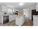 Charming kitchen features an island, neutral countertops, and white cabinets at 7289 Nc 561, Louisburg, NC 27549