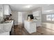 Bright kitchen with island, modern appliances, and hardwood floors at 7289 Nc 561, Louisburg, NC 27549